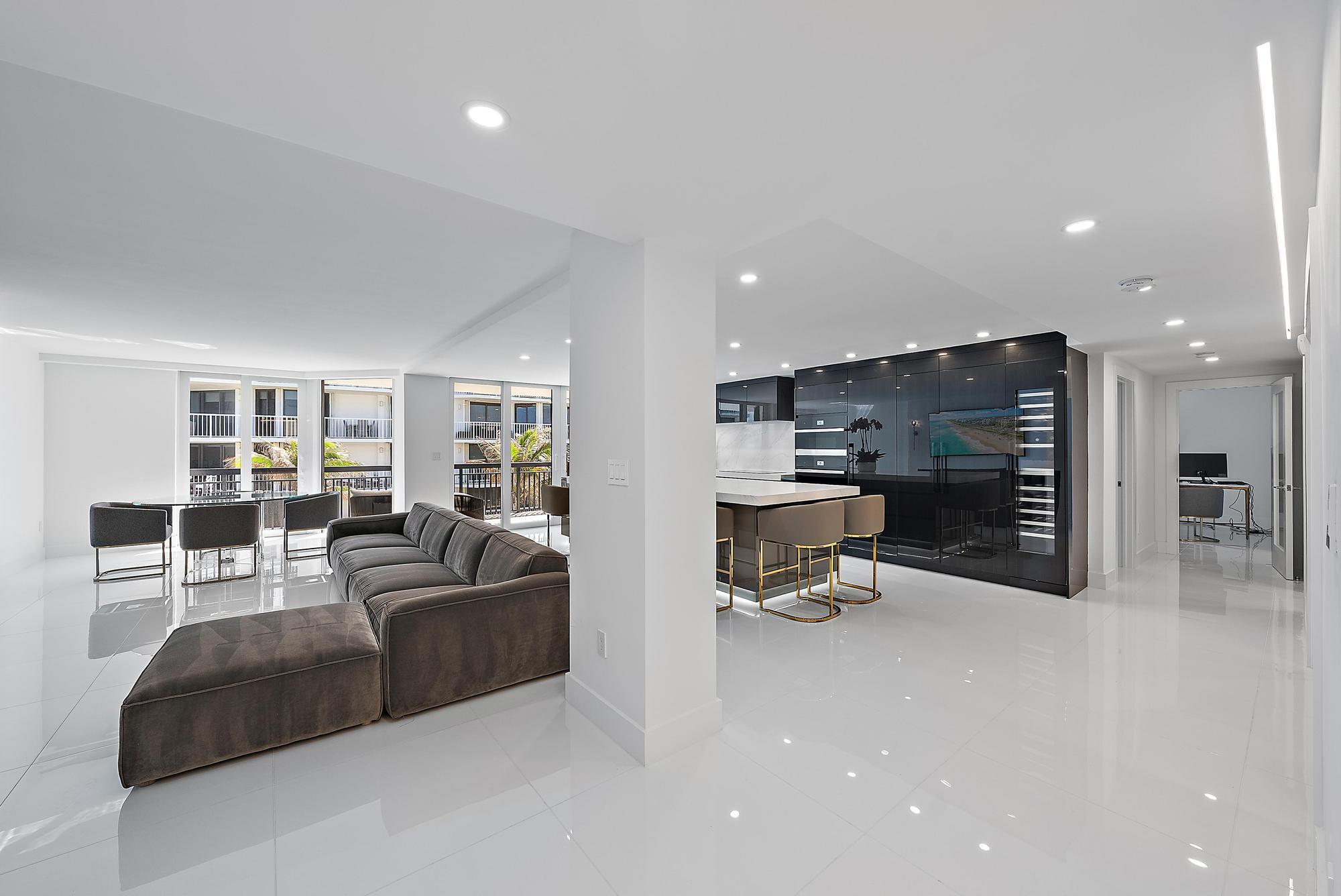 3140 South Ocean Boulevard, Unit 502S Palm Beach, FL 33480 - Photo 5 of 30 a living room with furniture and a flat screen tv