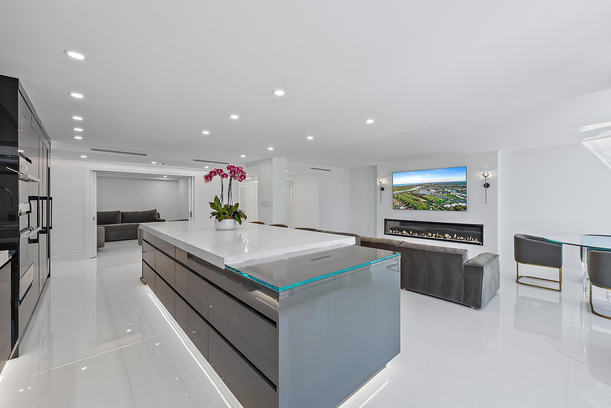 3140 South Ocean Boulevard, Unit 502S Palm Beach, FL 33480 - Photo 6 of 30 a kitchen with stainless steel appliances a stove a chimney a sink and a refrigerator