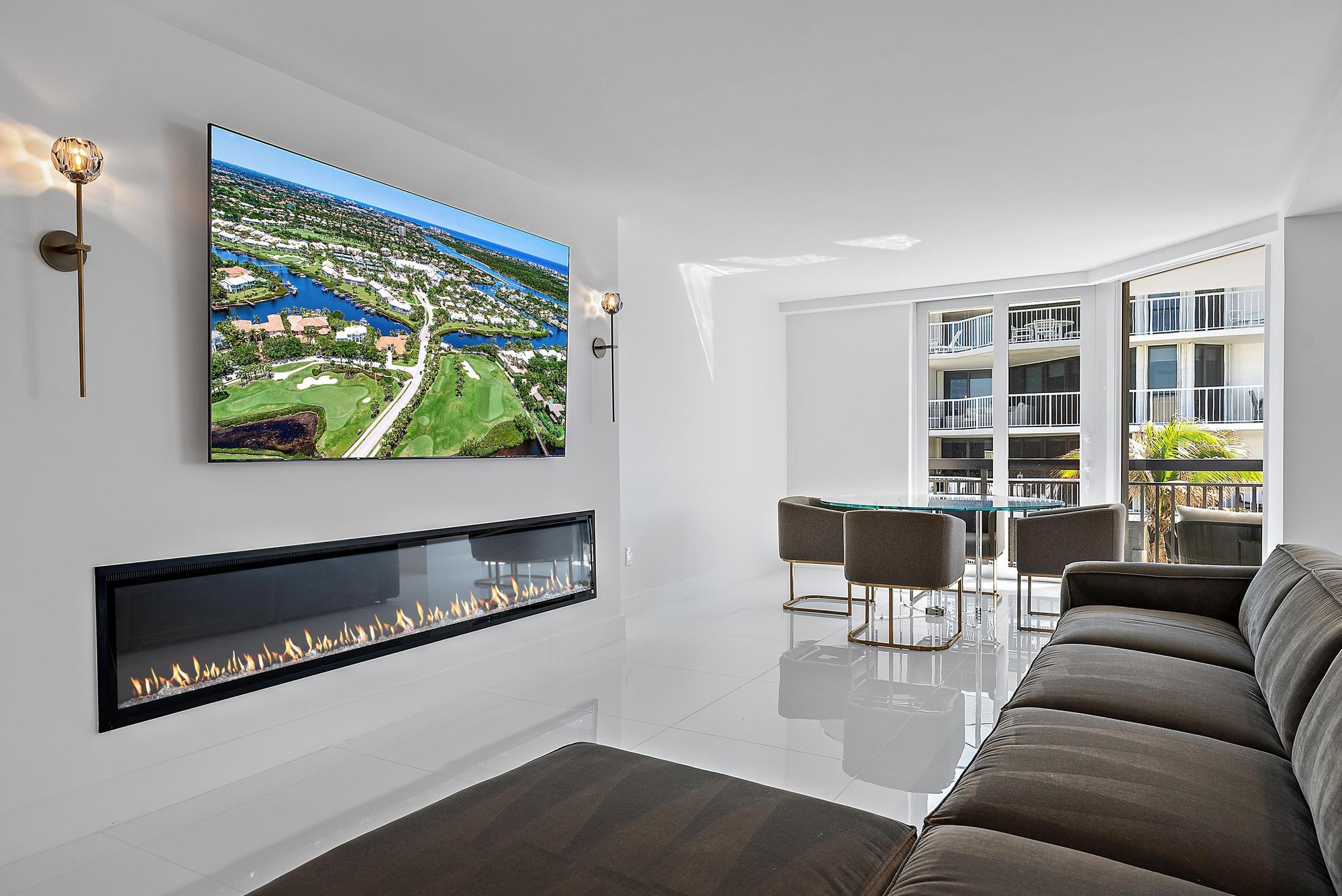 3140 South Ocean Boulevard, Unit 502S Palm Beach, FL 33480 - Photo 7 of 30 a living room with furniture and a flat screen tv