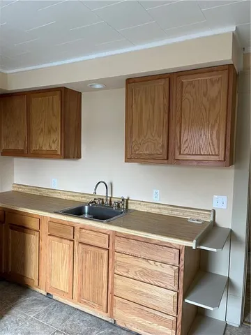 a kitchen with a sink cabinets and stainless steel appliances