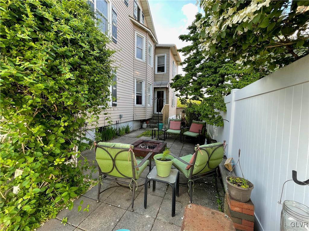 3675 Huckleberry Road Allentown, PA 18104 - Photo 17 of 44 a view of a patio with table and chairs and potted plants