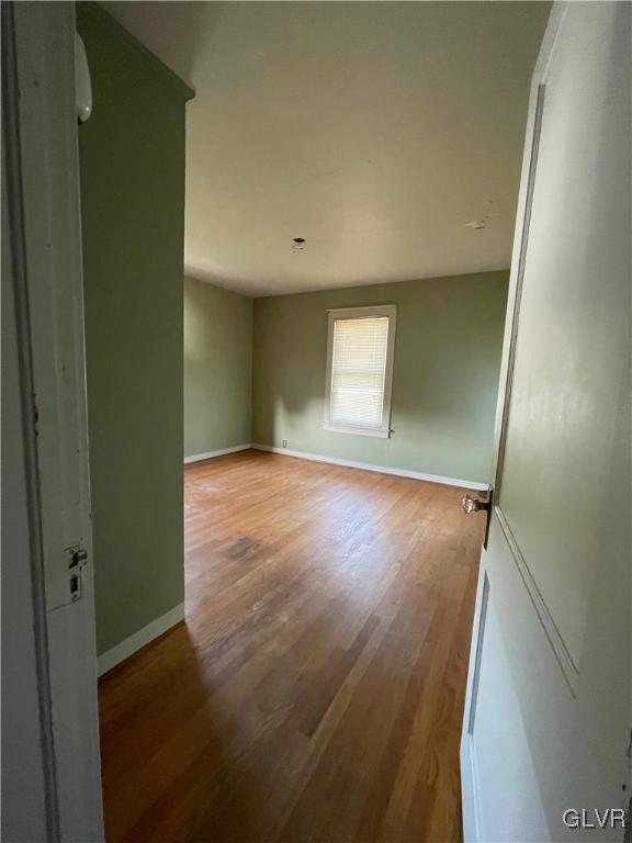 3675 Huckleberry Road Allentown, PA 18104 - Photo 39 of 44 an empty room with wooden floor and windows