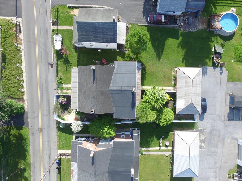 3675 Huckleberry Road Allentown, PA 18104 - Photo 4 of 44 an aerial view of a house with a garden