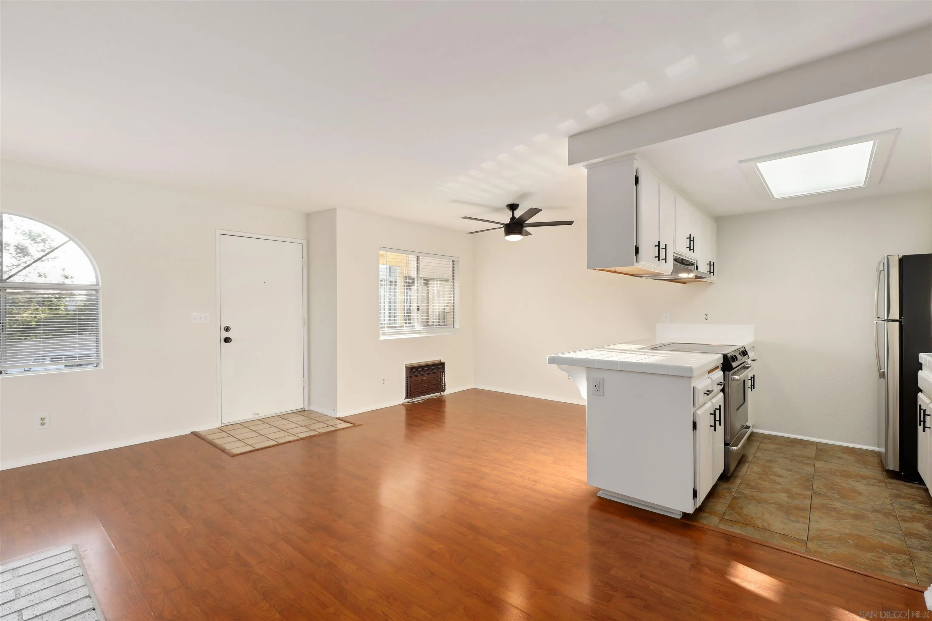 8475 Avenida Angulia, Unit 4 Spring Valley, CA 91977 - Photo 8 of 25 a view of kitchen with window and wooden floor