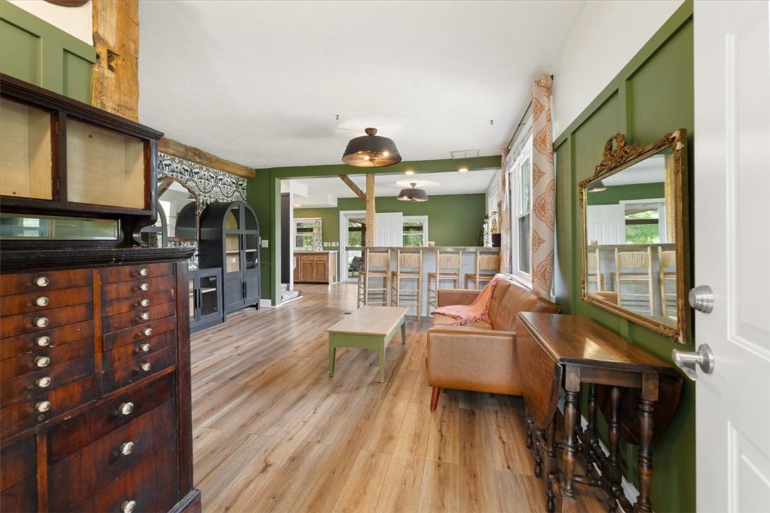 5120 Wheelock Road Troy, OH 45373 - Photo 67 of 67 This inviting space features warm wood flooring and a welcoming open floor plan.