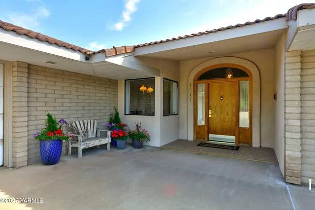 an aerial view of a house with a table and chairs