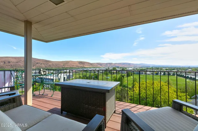 a bedroom with a bed and large window
