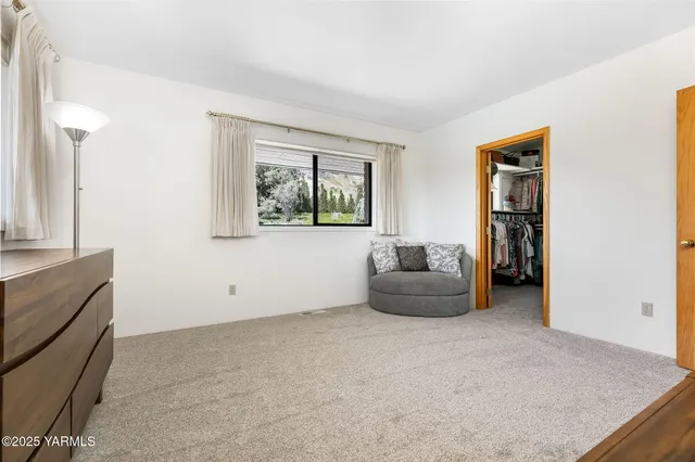 a living room with fireplace furniture and a flat screen tv