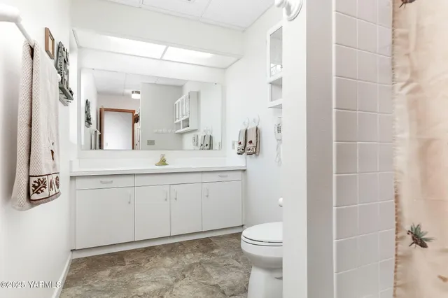 an aerial view of a house with yard tennis court and outdoor seating