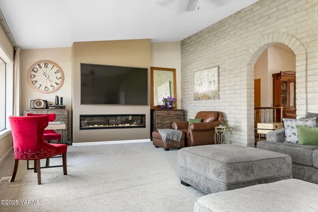 a large kitchen with stainless steel appliances granite countertop a stove and a sink