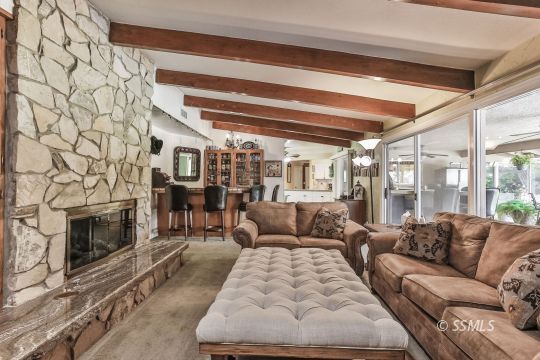 1509 Welcome Way Ridgecrest, CA 93555 - Photo 25 of 50 a living room with furniture and a fireplace
