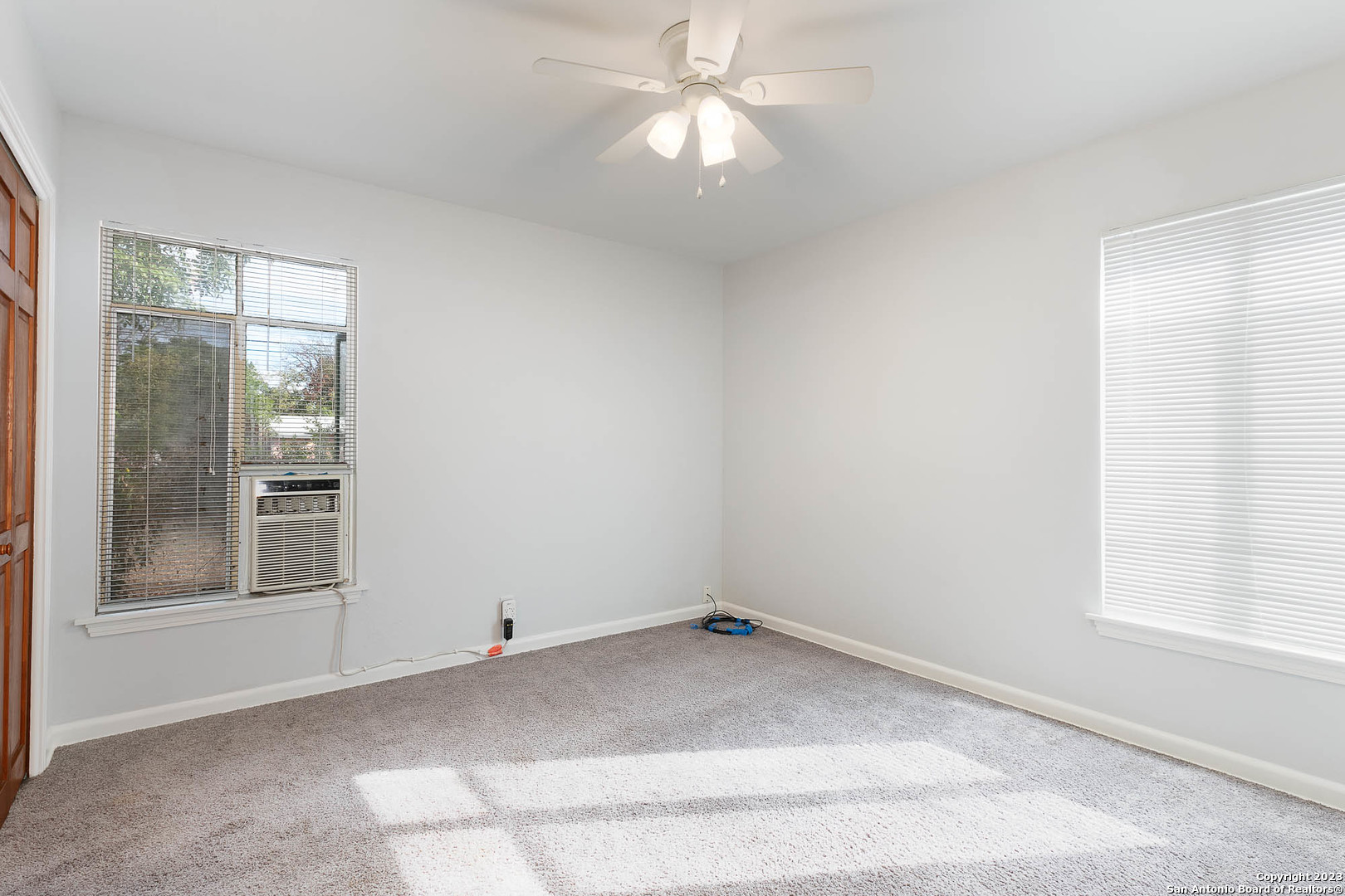 463 Cherry Ridge San Antonio, TX 78213 - Photo 12 of 19 an empty room with a window and ceiling fan