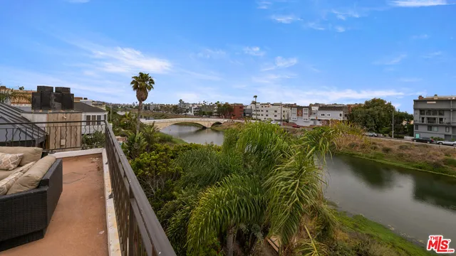 a living room with a couch and a wooden floor