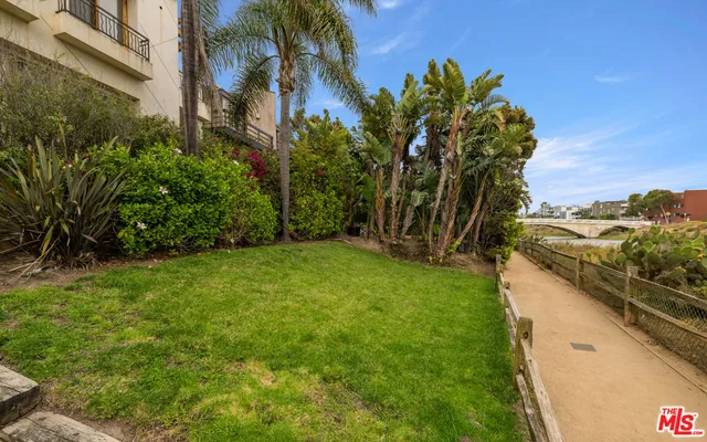 a bed room with a bed and a television