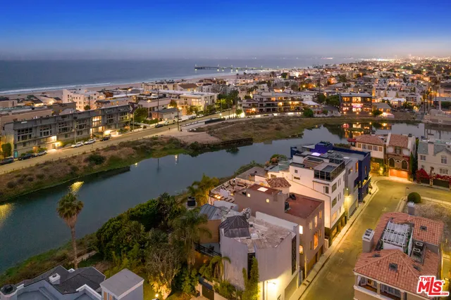 a view of a patio with swimming pool and furniture
