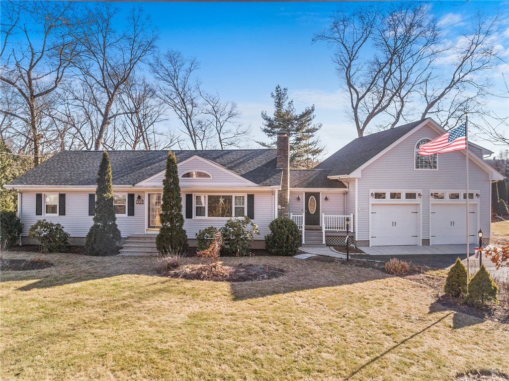 Stunning curb appeal with wonderful plantings and flower beds to soon be in full bloom!