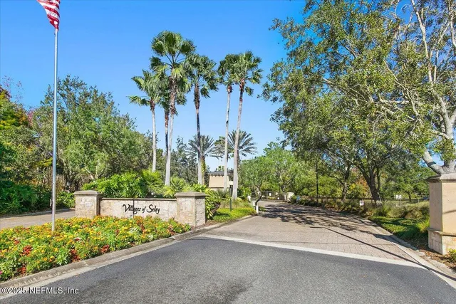 a view of a street with a building in the background