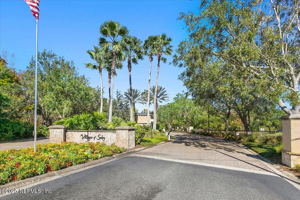 a view of a street with a building in the background