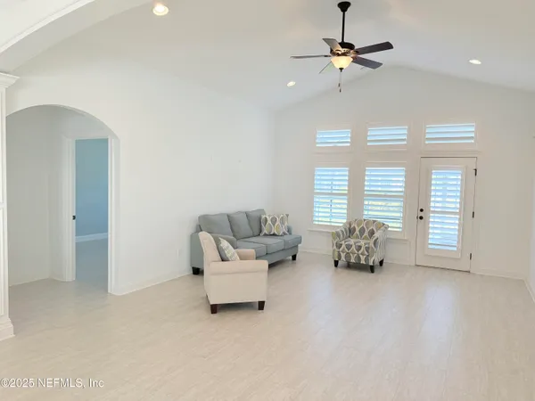 a living room with furniture and a window