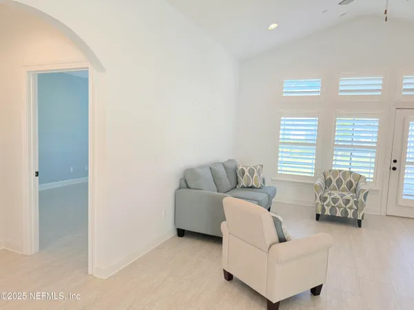 a living room with furniture and a window