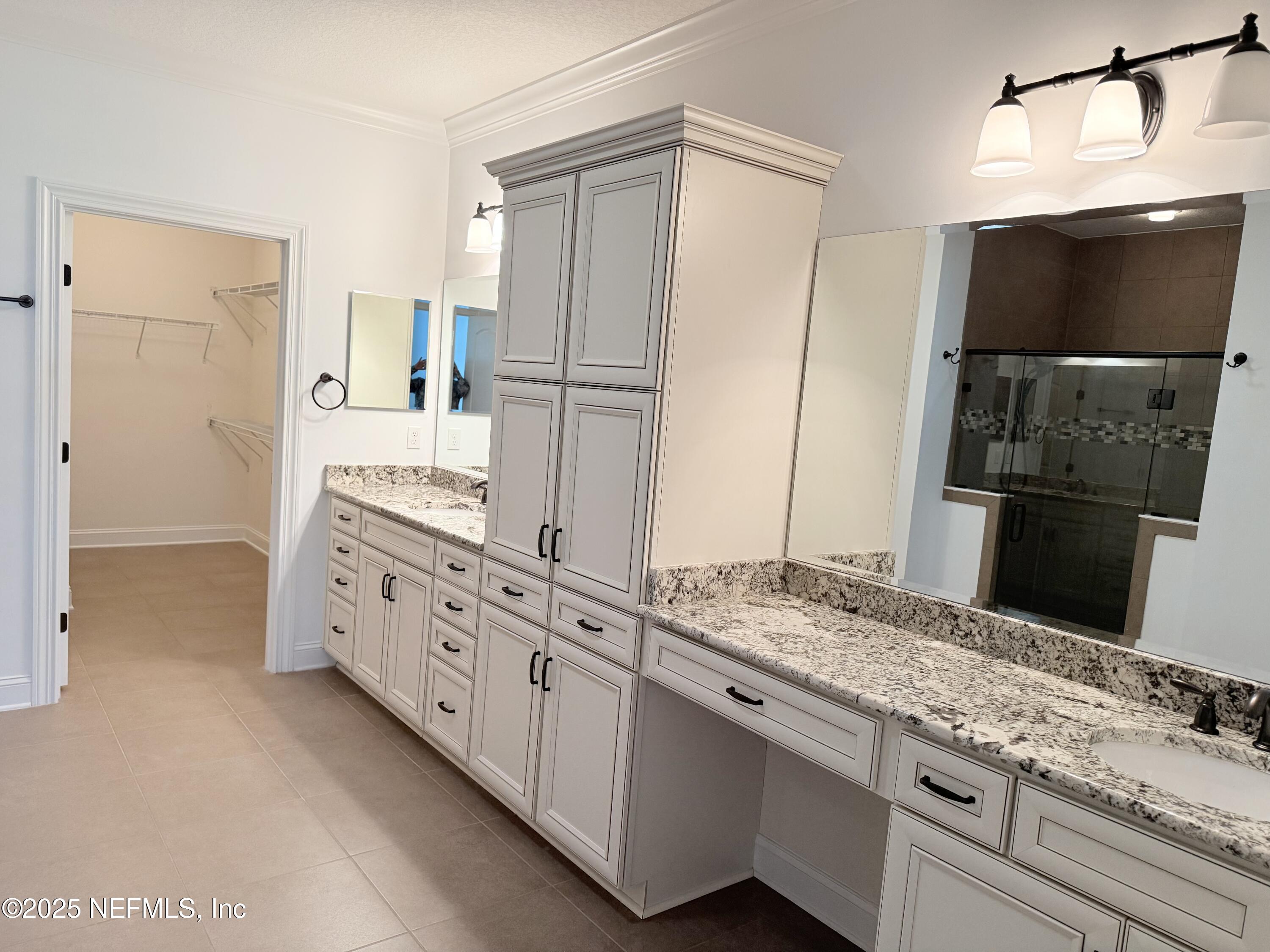 44 Ocale Court St. Augustine, FL 32084 - Photo 20 of 30 a bathroom with a double vanity sink and mirror