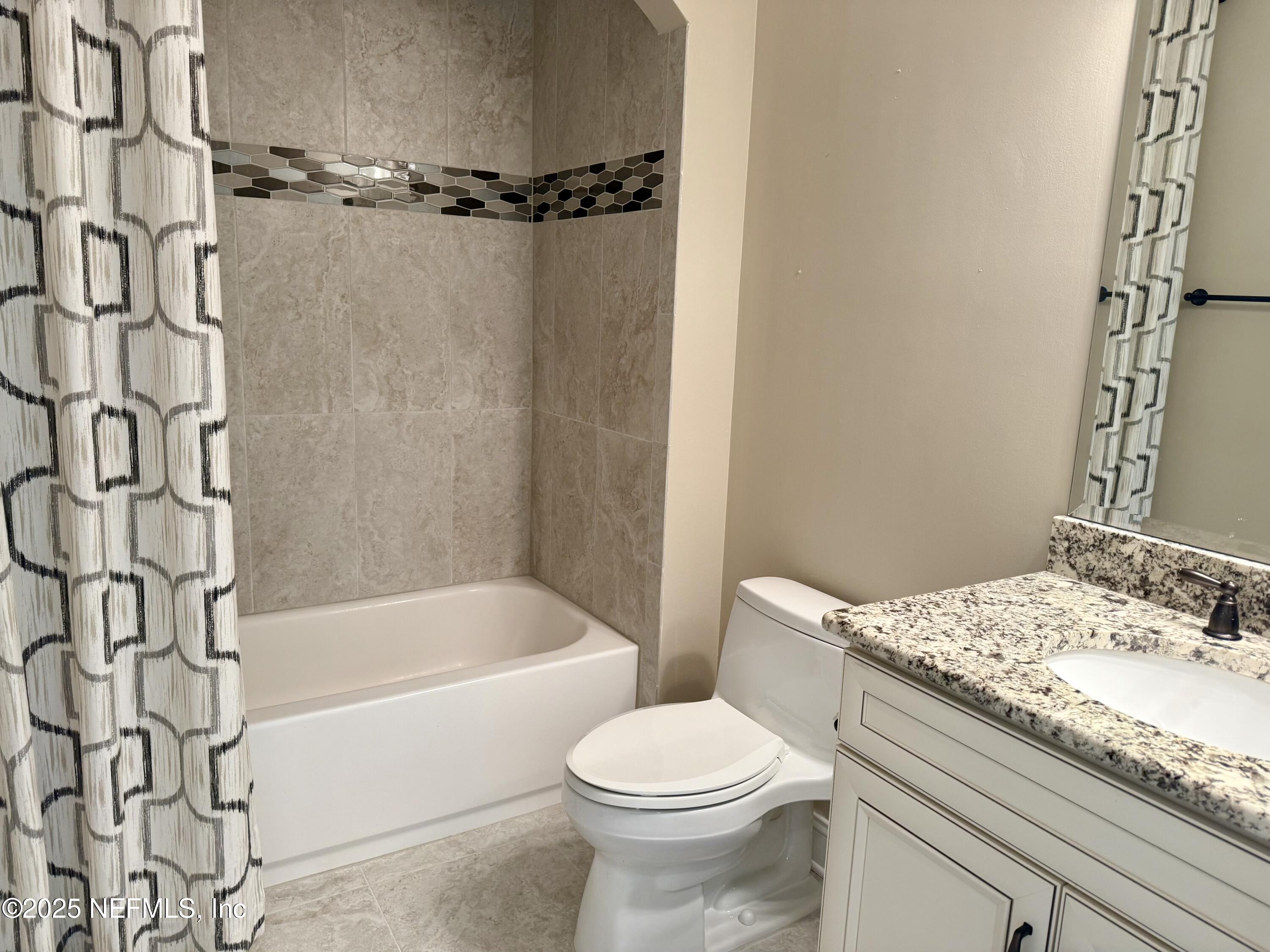 44 Ocale Court St. Augustine, FL 32084 - Photo 26 of 30 a bathroom with a granite countertop sink toilet and shower