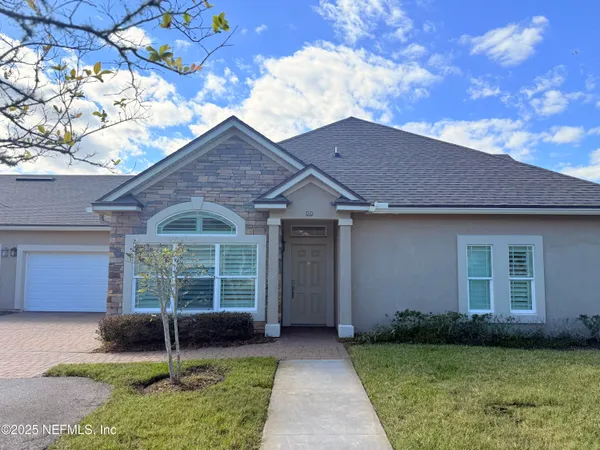 a backyard of a house with yard and barbeque oven