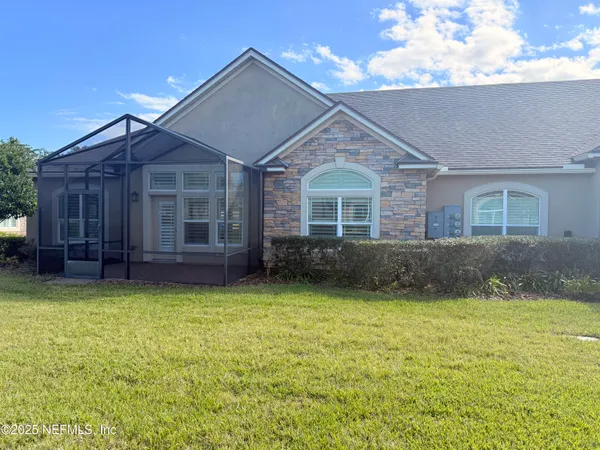 a view of a house with swimming pool and a yard
