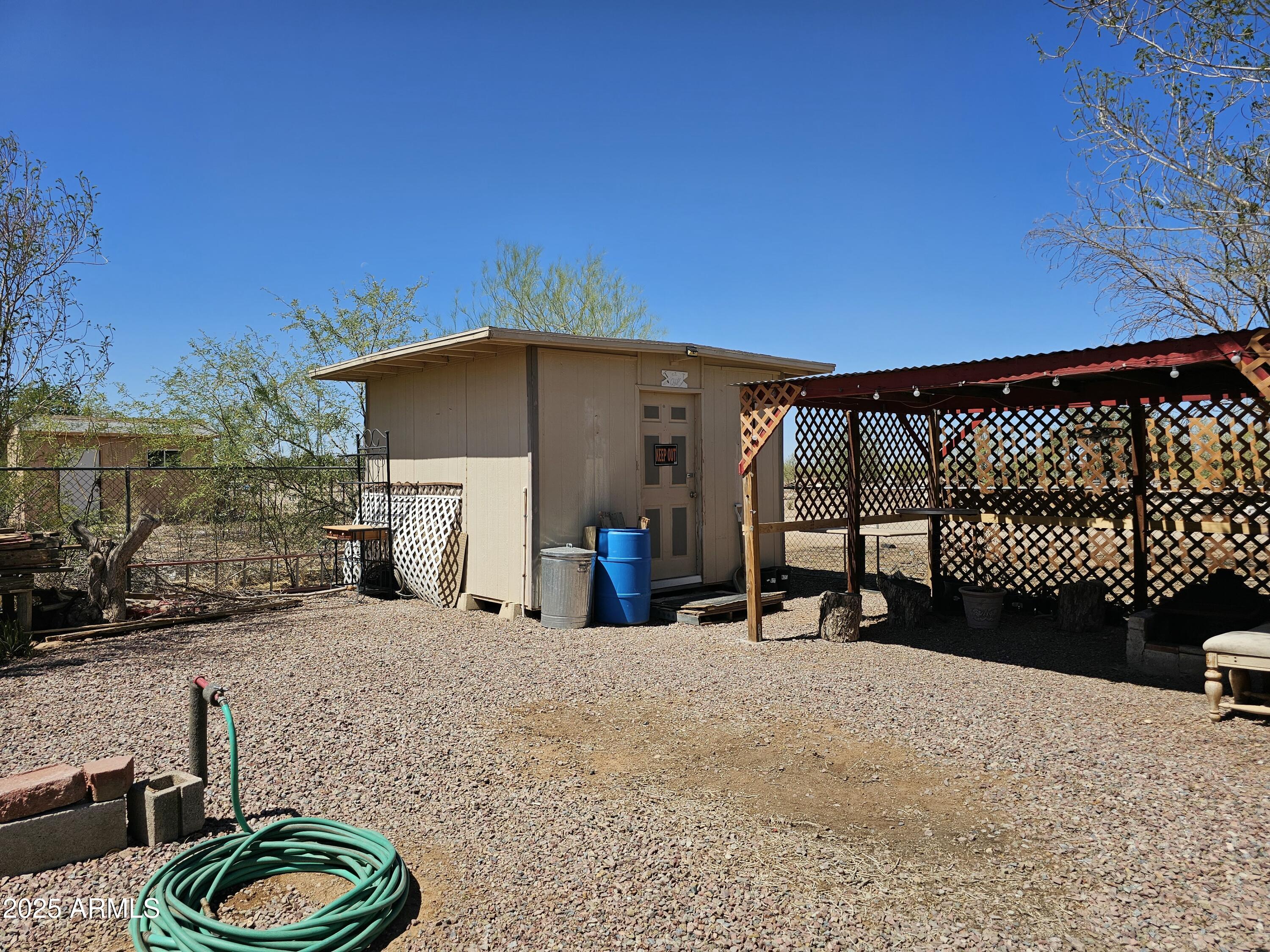 6830 East Shasta Street Picacho, AZ 85141 - Photo 13 of 19 a view of a chairs and tables in the patio
