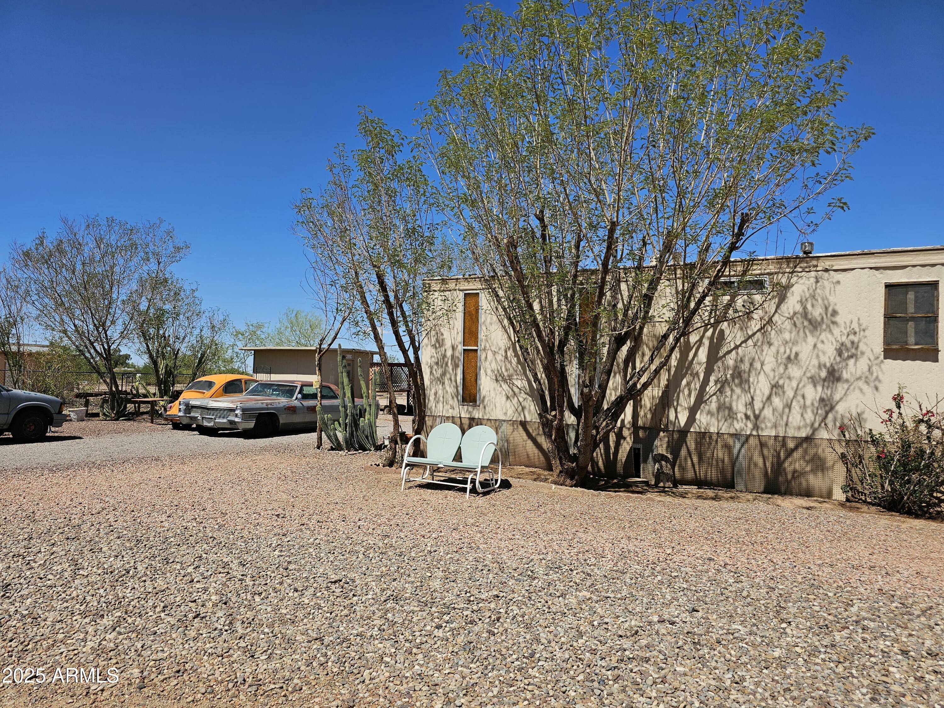 6830 East Shasta Street Picacho, AZ 85141 - Photo 2 of 19 a view of car parked on the side of the road