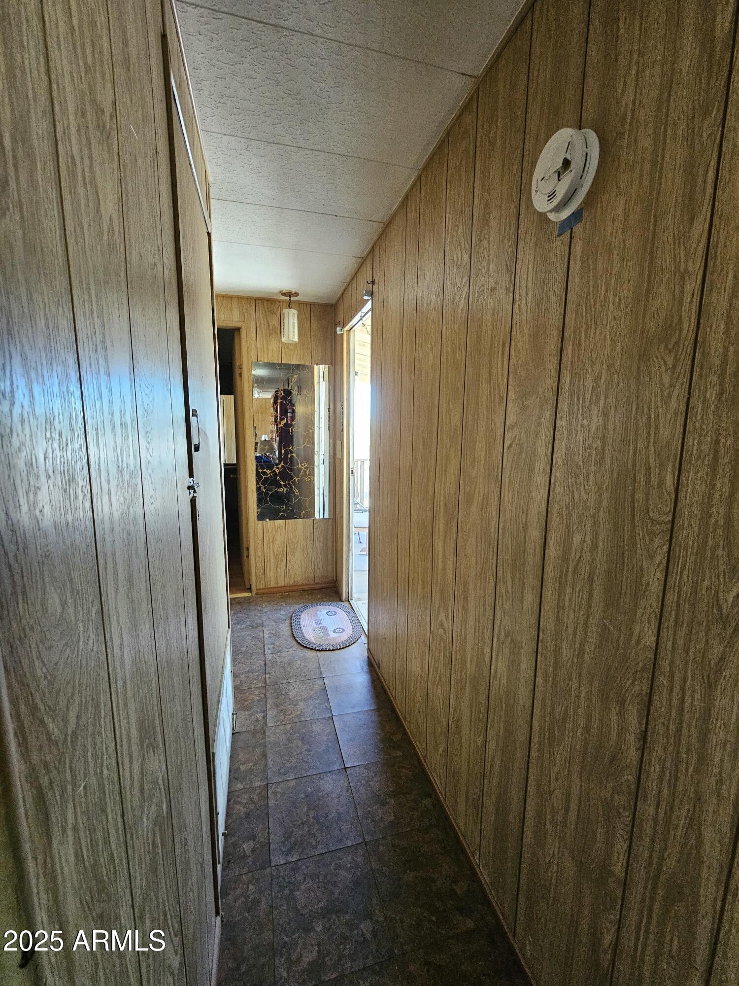 6830 East Shasta Street Picacho, AZ 85141 - Photo 5 of 19 a view of a hallway with wooden floor