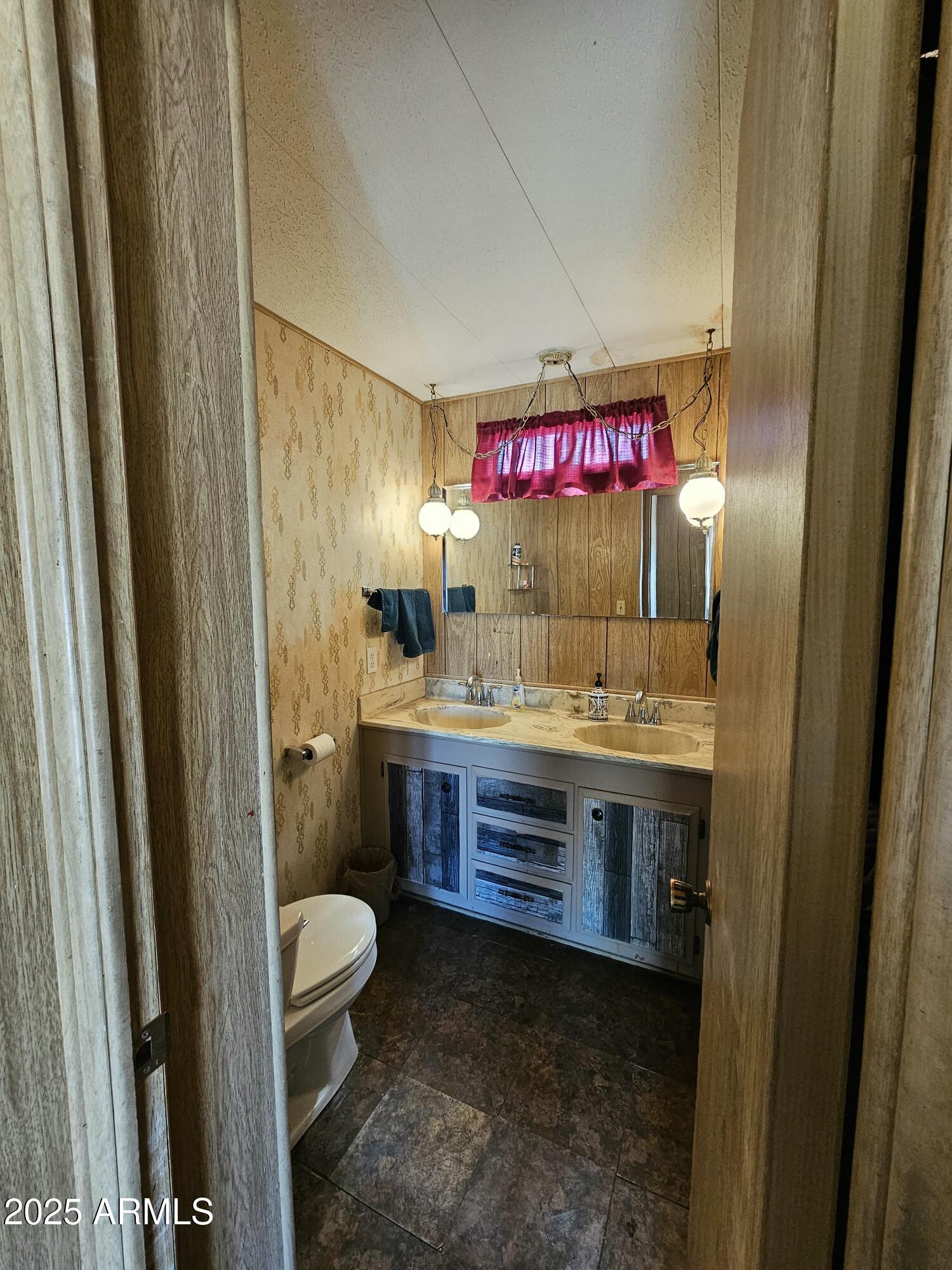 6830 East Shasta Street Picacho, AZ 85141 - Photo 6 of 19 a bathroom with a sink and a mirror