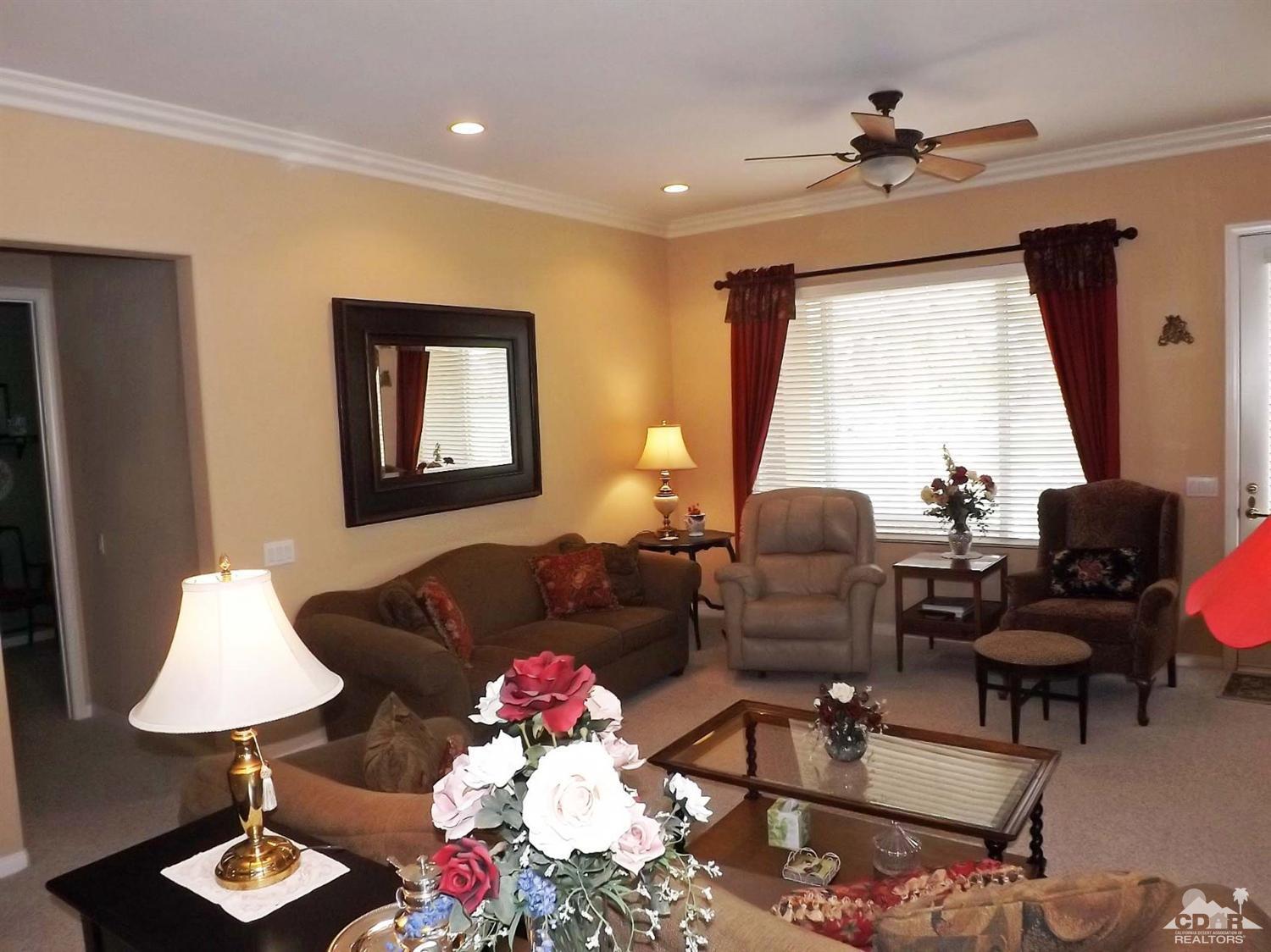 80540 Knightswood Road Indio, CA 92201 - Photo 11 of 34 a living room with furniture and a window