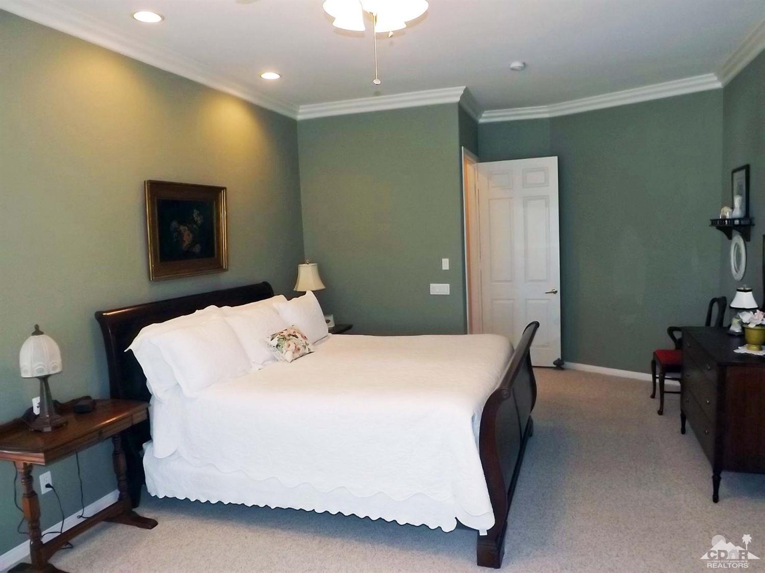 80540 Knightswood Road Indio, CA 92201 - Photo 14 of 34 a bedroom with a bed and a desk in it