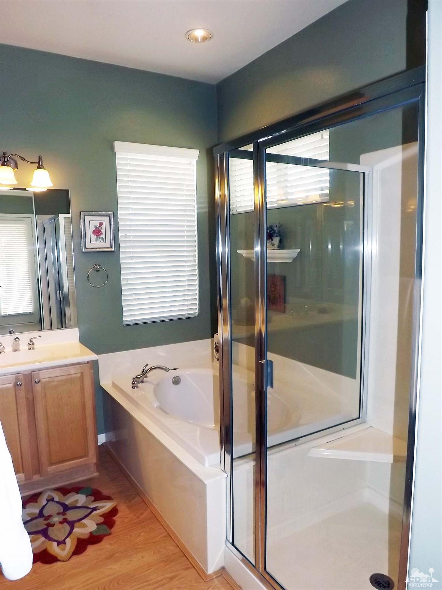 80540 Knightswood Road Indio, CA 92201 - Photo 16 of 34 a bathroom with a bathtub and a shower