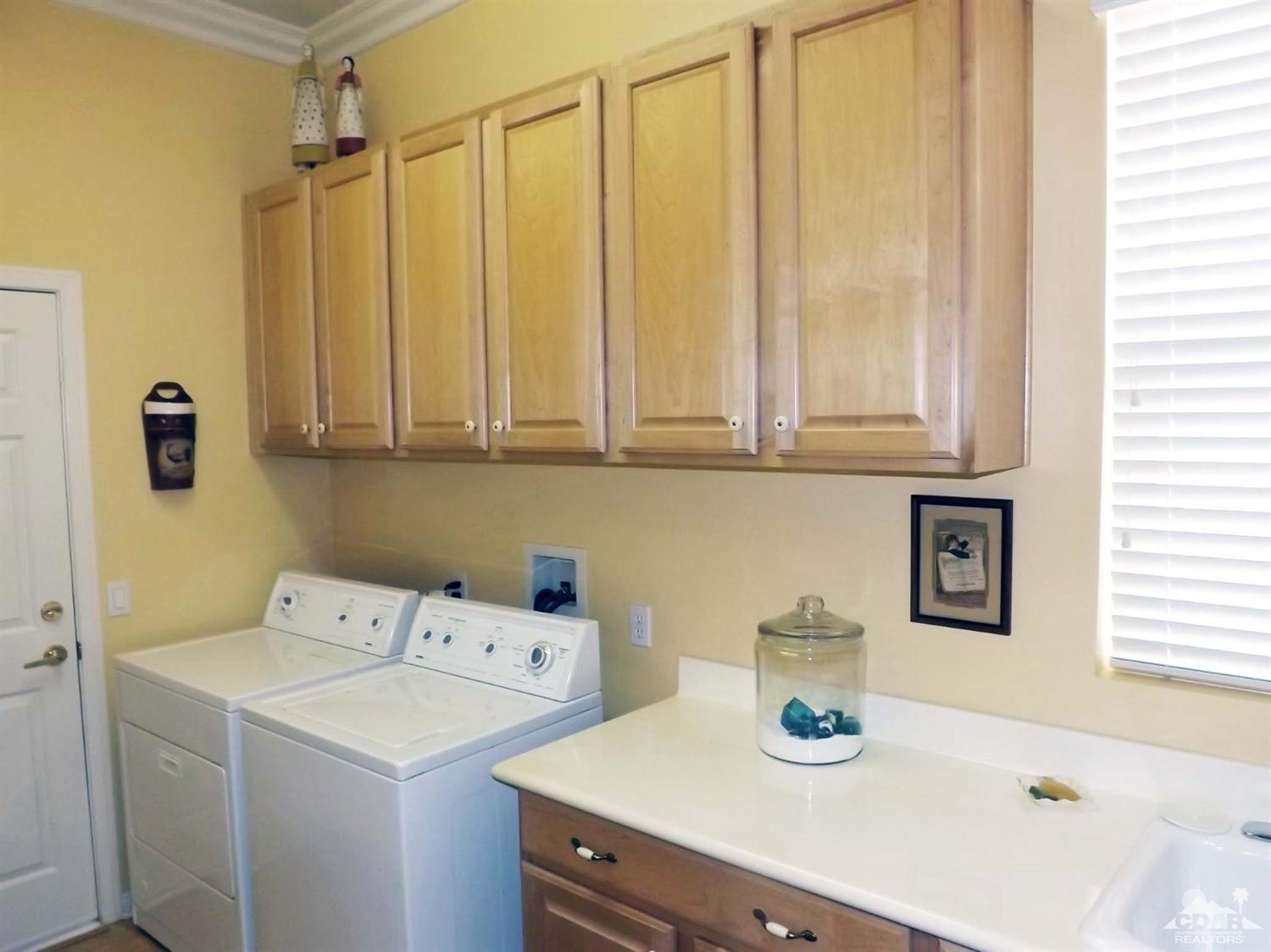 80540 Knightswood Road Indio, CA 92201 - Photo 20 of 34 a bathroom with a sink a vanity and a window