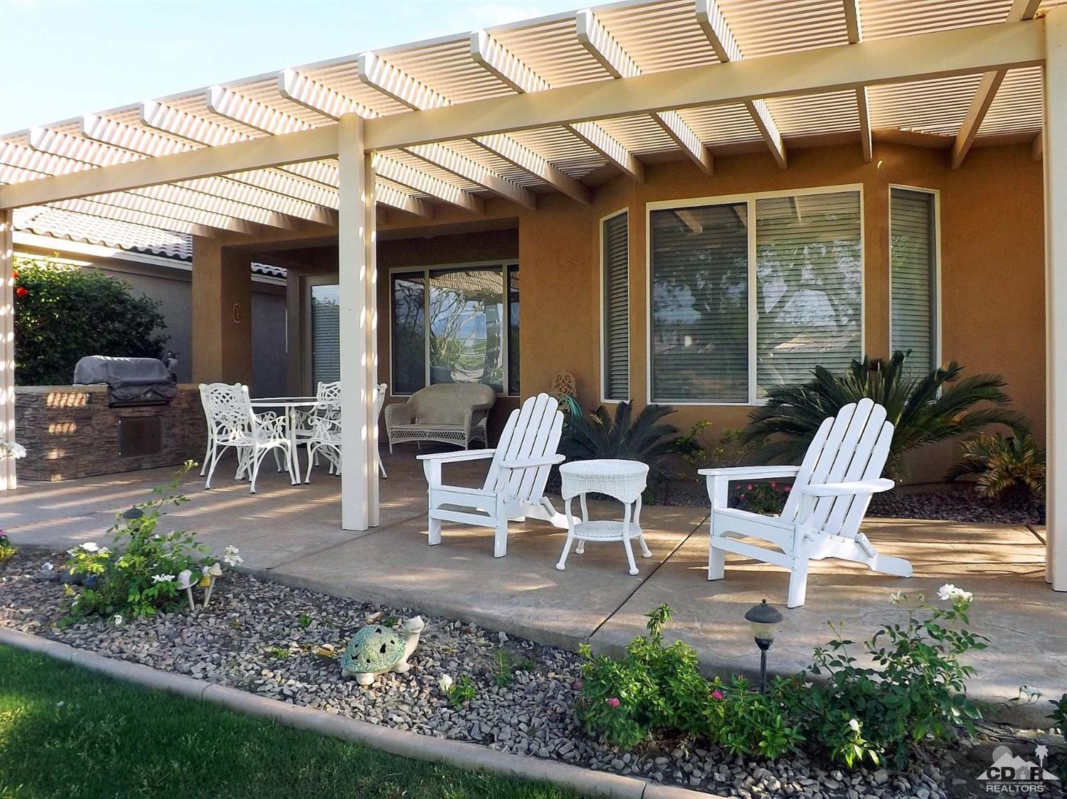 80540 Knightswood Road Indio, CA 92201 - Photo 21 of 34 a building outdoor space with patio furniture and potted plants