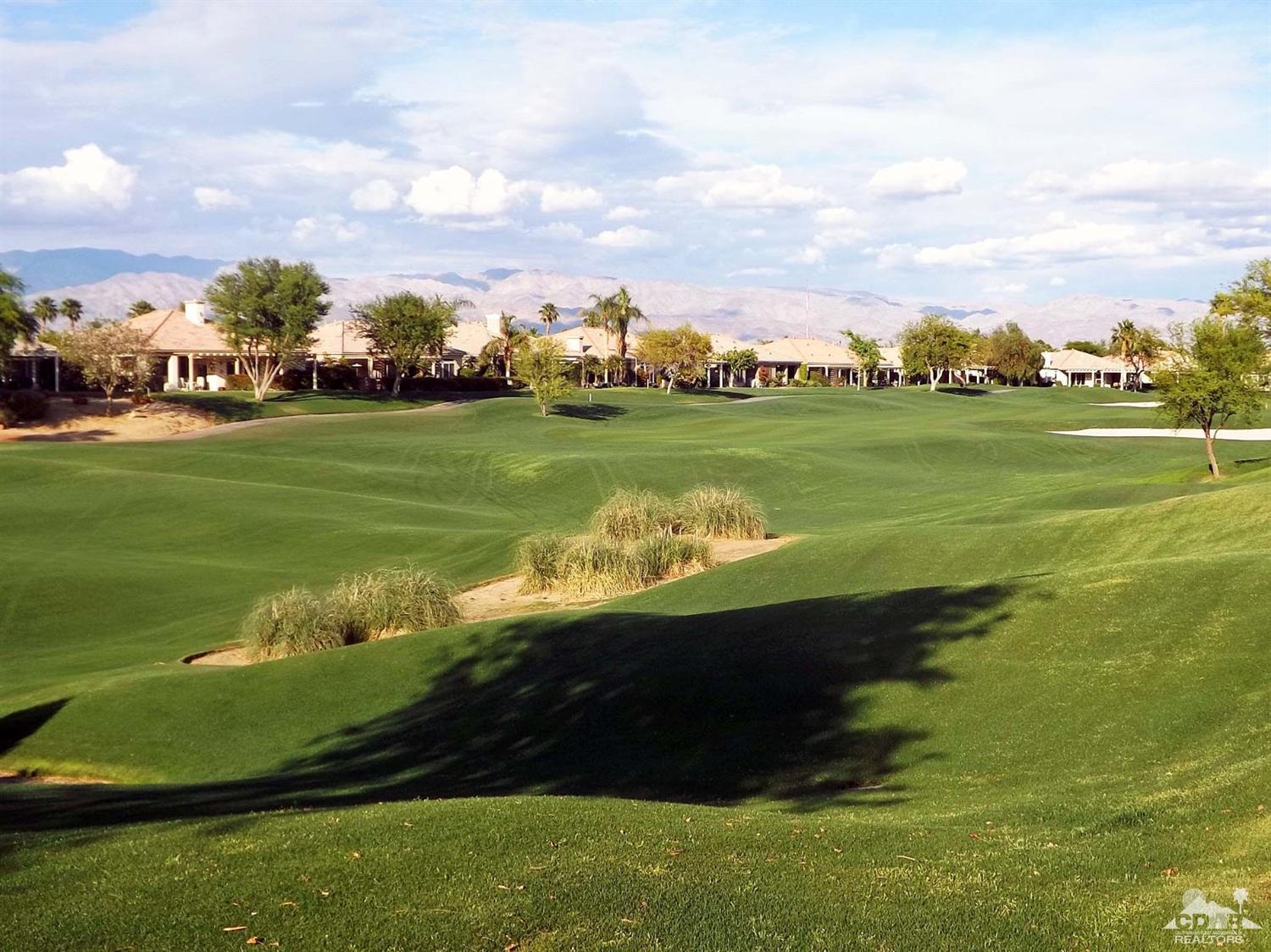 80540 Knightswood Road Indio, CA 92201 - Photo 25 of 34 a view of a lake with houses in the background