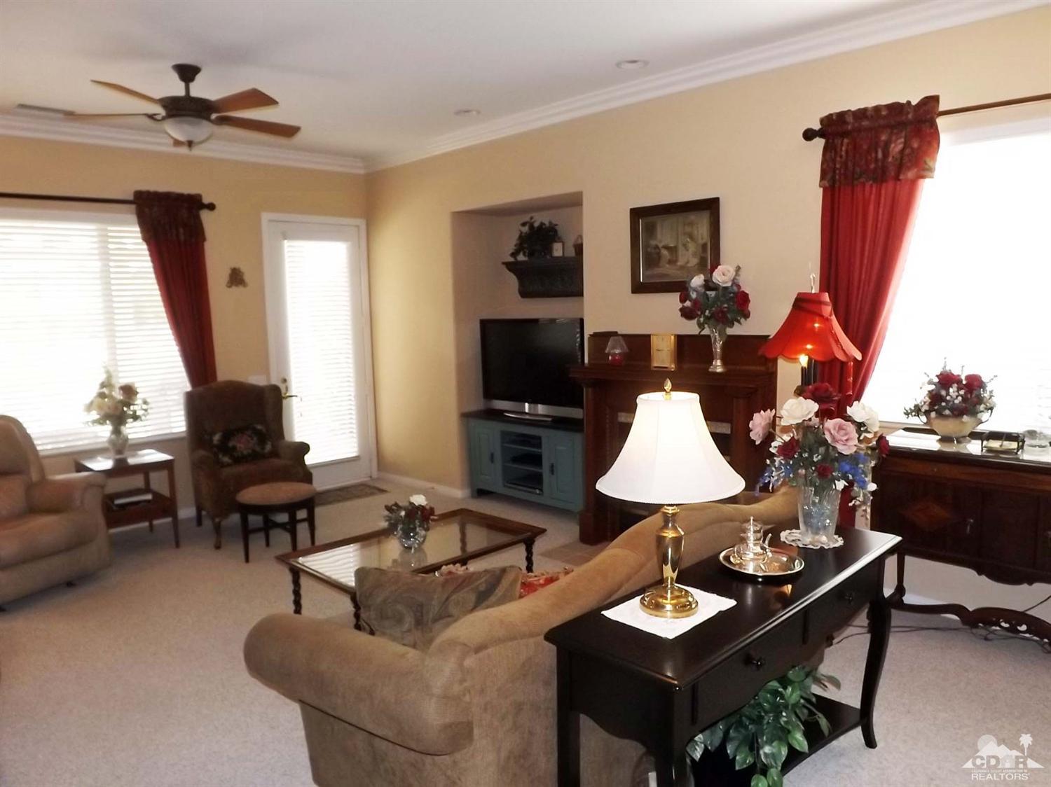 80540 Knightswood Road Indio, CA 92201 - Photo 10 of 34 a living room with furniture and a flat screen tv
