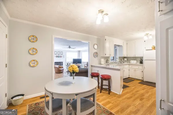 a kitchen with stainless steel appliances granite countertop a sink and a stove