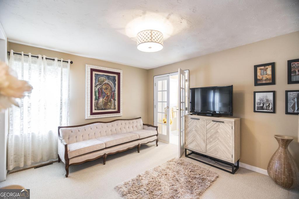 209 Spillers Street Fort Valley, GA 31030 - Photo 15 of 36 a living room with furniture and a flat screen tv