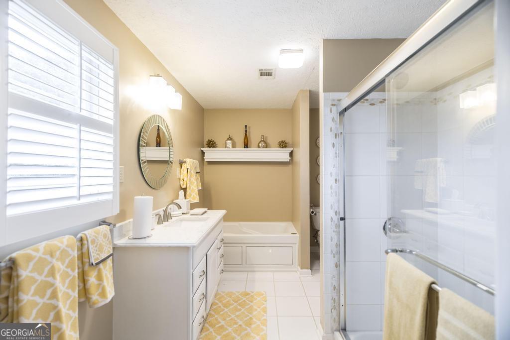 209 Spillers Street Fort Valley, GA 31030 - Photo 16 of 36 a bathroom with a sink mirror vanity and toilet
