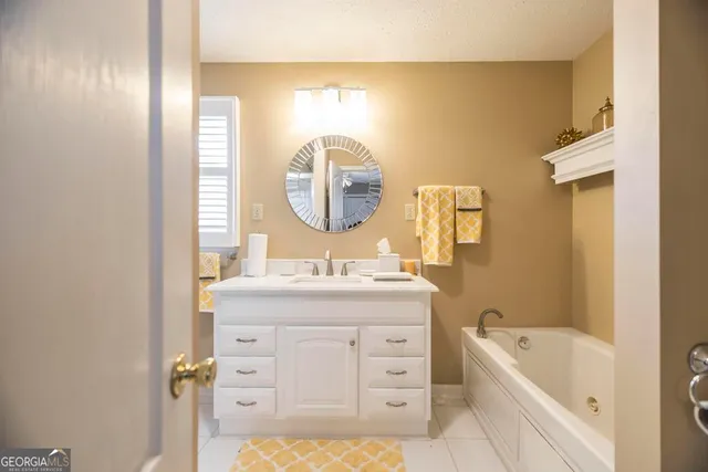 a bedroom with a bed chair and a window