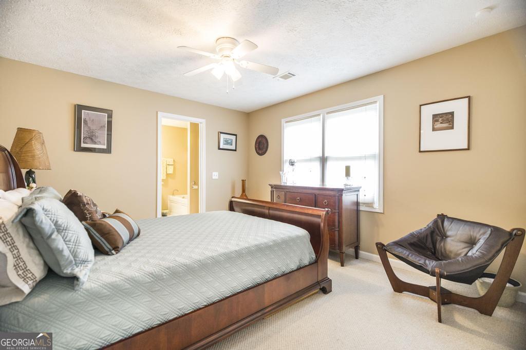 209 Spillers Street Fort Valley, GA 31030 - Photo 18 of 36 a bedroom with a bed chair and a window