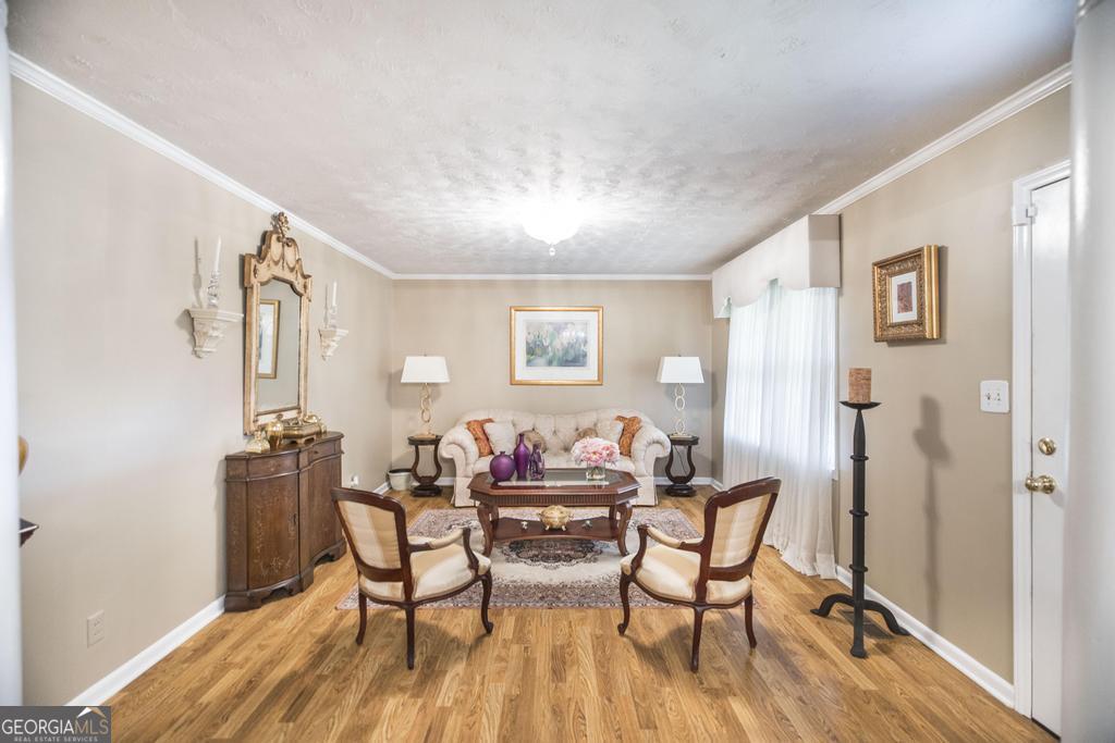 209 Spillers Street Fort Valley, GA 31030 - Photo 3 of 36 a dining room with furniture and wooden floor