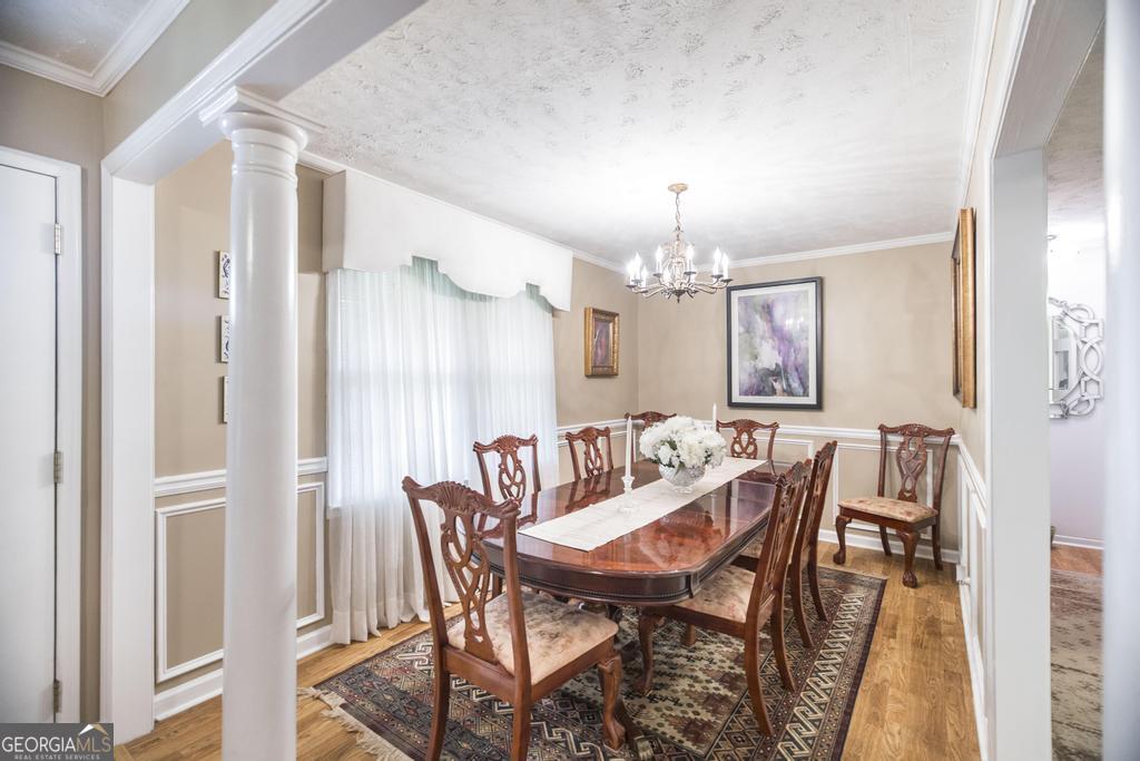209 Spillers Street Fort Valley, GA 31030 - Photo 5 of 36 a view of a dining room with furniture and chandelier