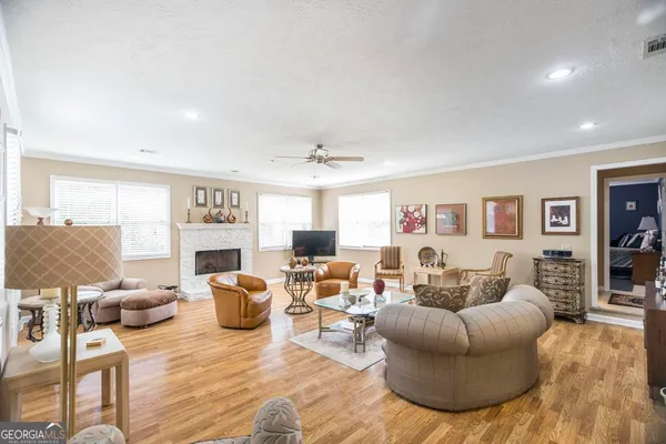 a living room with furniture and a fireplace
