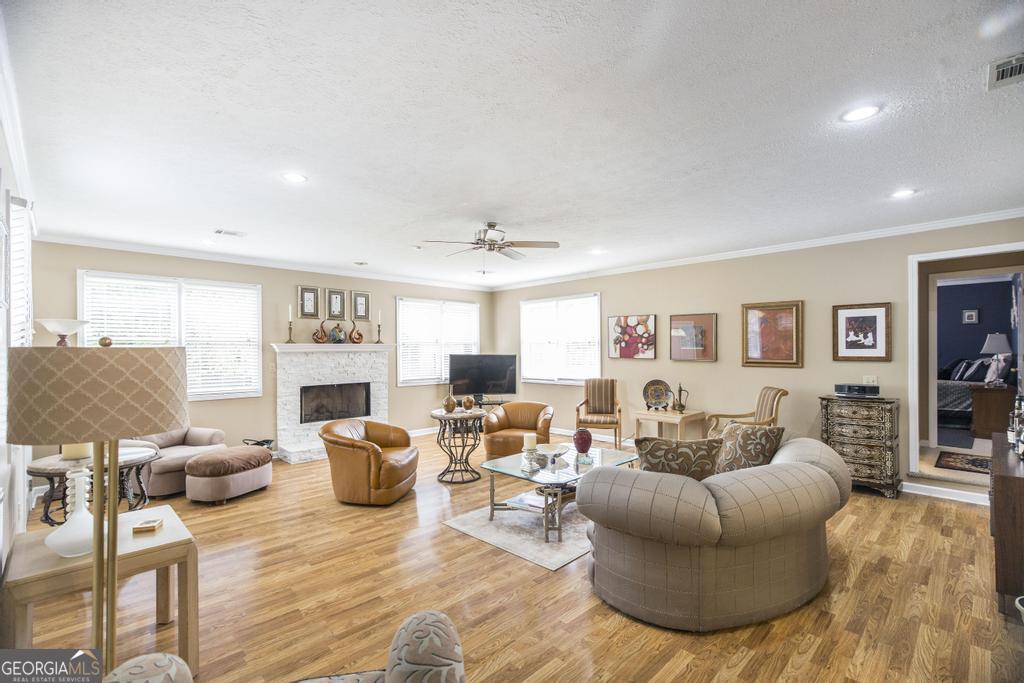 209 Spillers Street Fort Valley, GA 31030 - Photo 7 of 36 a living room with furniture and a fireplace