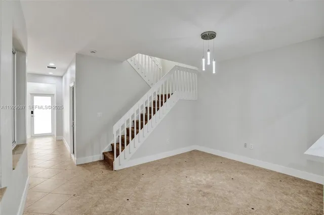 a view of a hallway with staircase