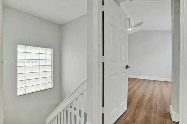 a view of an entryway with wooden floor